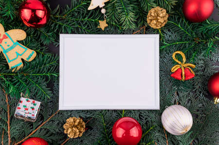 Flat lay minimal style. Christmas decoration with frame. Holidays theme photo.の写真素材