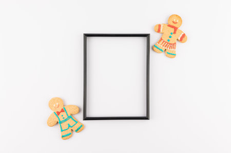 Christmas theme minimalist picture frame. Frame surrounded with Christmas decorations. Flatlay...