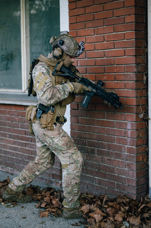 portrait of a special forces soldier with assault rifle on the street