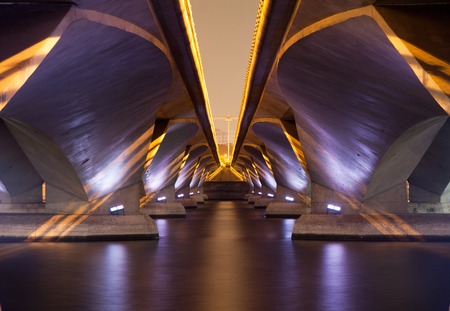 A light show and shadow of under Esplanade Bridge, Singapore.