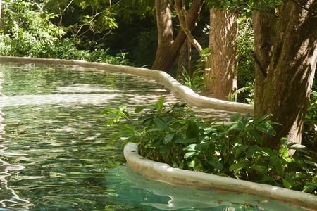 Pool with hot natural water in the jungle of costa ricaの写真素材