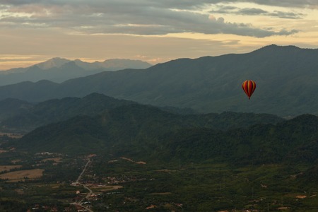 Landscape of Vang Vieng, Laos - Hot air baloon in the skyの写真素材