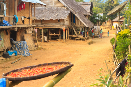 Local people in their daily life in the Small village - drying chilli in the sunのeditorial素材