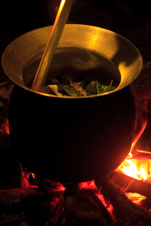 Big Pot on the camp fire in the evening. Spring mountains.の写真素材