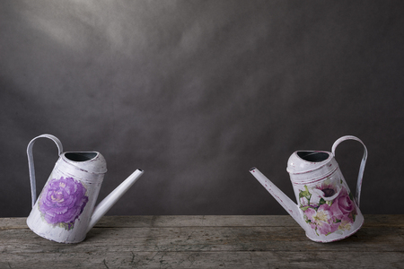 Two vilage water cans hand painted in the rustic style.の写真素材