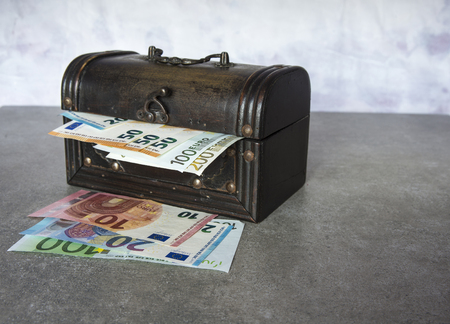 Euro banknotes inserted in the vintage chestの写真素材