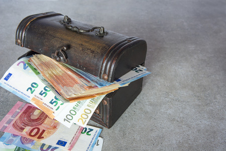 Euro banknotes stuffed in the vintage chestの写真素材