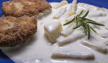 Rissole close up with young beans on the plateの写真素材