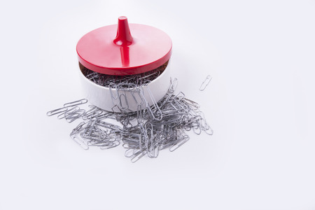 Full bowl of paper clips on the white backgroundの写真素材