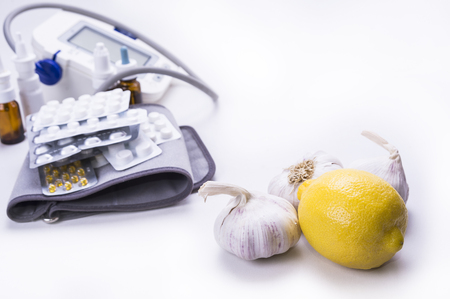 Natural remedy garlic lemon versus drugs and pillsの写真素材