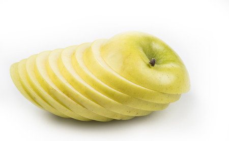 Apple cut on thin slices on the white backgroundの写真素材