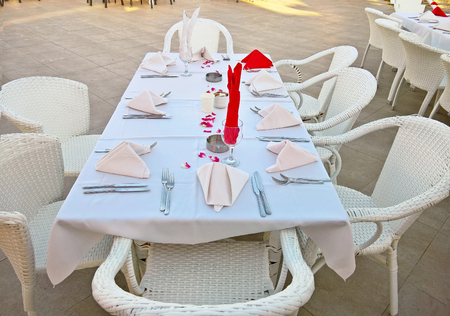Outdoor wedding festive table with white table clothe.の写真素材
