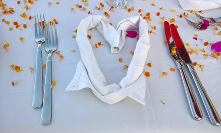 Outdoor wedding festive table with white table clothe.