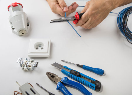 Set of electrical tool on wooden background. Accessories for engineering work, energy concept
