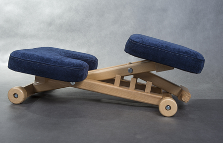 Kneeling chair for healthy sitting. Knee chair support your back.の写真素材