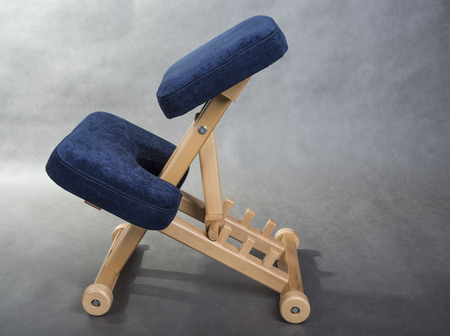 Kneeling chair for healthy sitting. Knee chair support your back.の写真素材