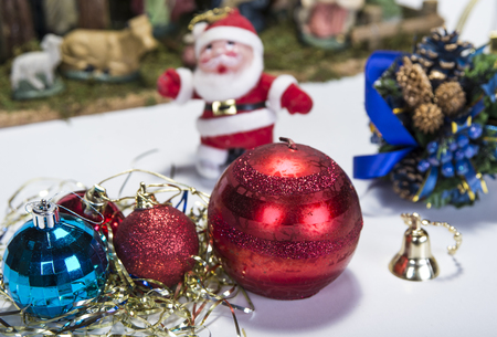 Christmas background with decorations  bells, ribbon and balls on white.の写真素材