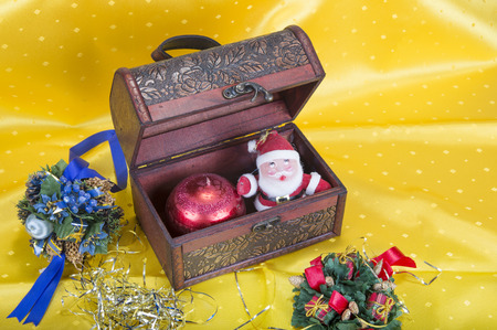 Christmas background with decorations  bells, ribbon and balls  and chestの写真素材