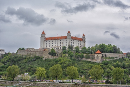 Slovakia, Bratislava - November 5th, 2017 Bratislava Castle on the hill, Parliament and Danube river .のeditorial素材
