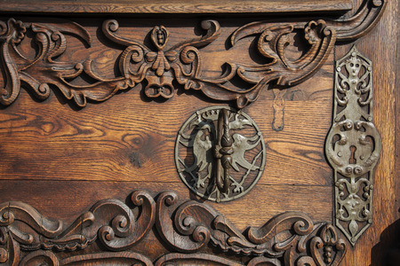 Slovakia, Bratislava - November 5th, 2017 historic old town, buildings from austro-hungarian empire. Entrance wooden door to churchのeditorial素材