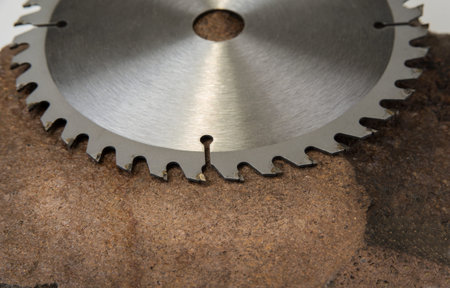 Circular saw blade for wood work on the stone background