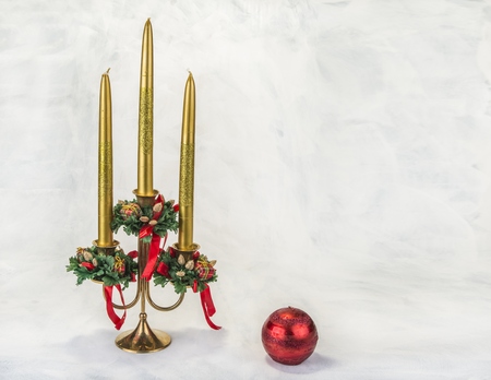 Candlestick with christmas decoration on the grunge backgroundの写真素材