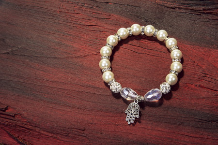 Pearl bracelet jewerly on the wood or stone backgroundの写真素材