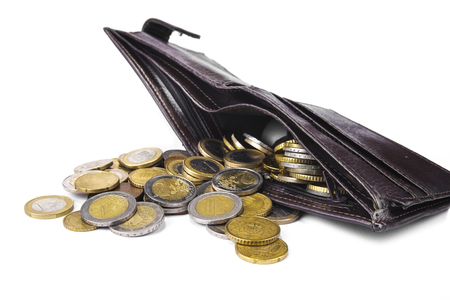 New wallet full of euro coins on white backgroundの写真素材