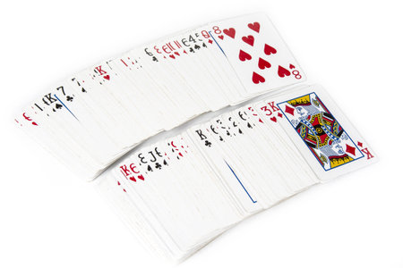 Playing cards spreaded on the white background