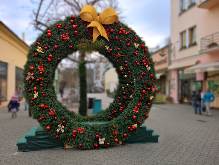 Big christmas wreath with baw in the town square.の写真素材