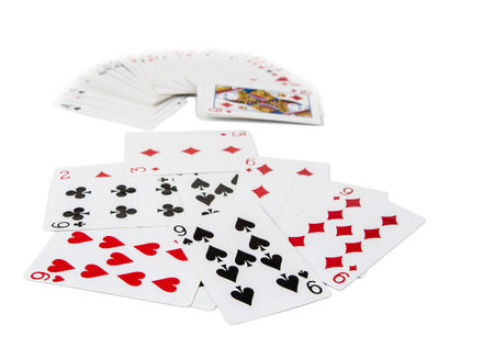 Playing cards spreaded on the white background