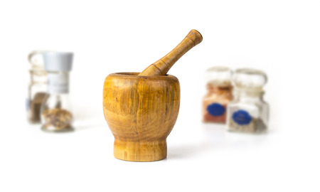 Wood mortar with pestle on the white backgroundの写真素材