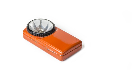 Old battery flashlight on the white backgroundの写真素材
