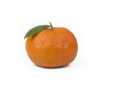 Tangerine or clementine with green leaf isolated on white backgroundの写真素材