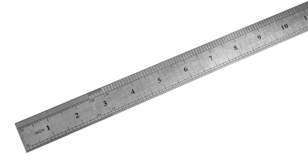 Metal ruler in centimeters or inches. Measuring tool on the white backgroundの写真素材