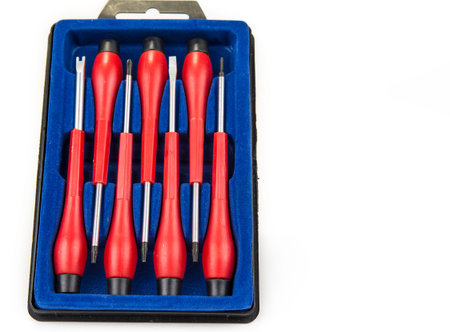 Set of pricise screwdrivers in the box on the white