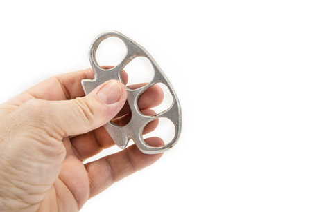 Iron fist with hand for self defence or fight on the whiteの写真素材