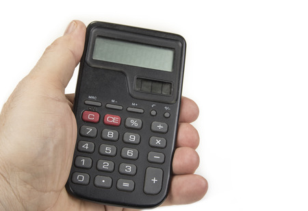 Small calculator with big numbers in hand on the whiteの写真素材