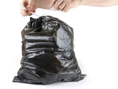 Tied up black trash bag ready to put to garbage