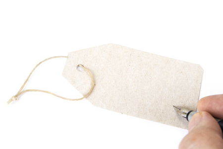 Blank paper label or cloth tag on the whiteの写真素材