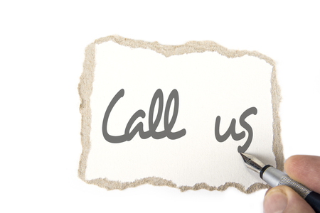 Torn blank cardboard paper with the hand and the pen. Call usの写真素材