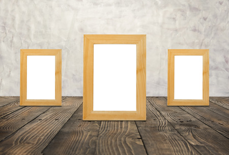 Blank wooden frames on the brown wood floorの写真素材