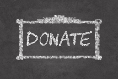 Chalkboard with a donate sign asking dor helpの写真素材