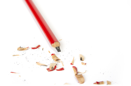 Carpenter pencil sharpen with cutter knife on whiteの写真素材