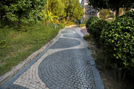 Cobblestone walk in the garden in summerの写真素材