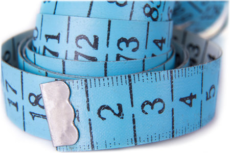 The tape meter closeup on the white background