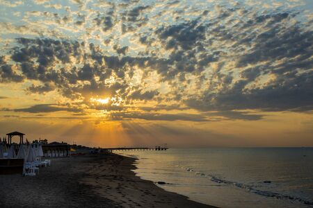 Sunset at the sea in the summer resortの写真素材