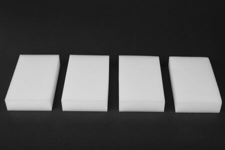 Kitchen melamine sponge on a black backgroundの写真素材