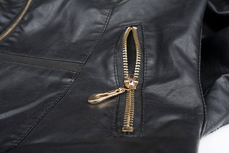 Woman leather black jacket with zip on a white