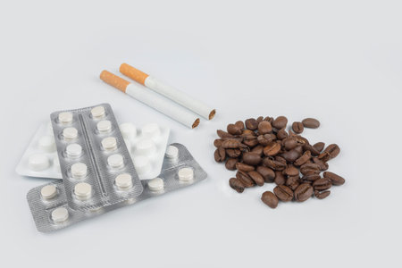 Bad lifestyle. Cigarette coffee and pills concept
